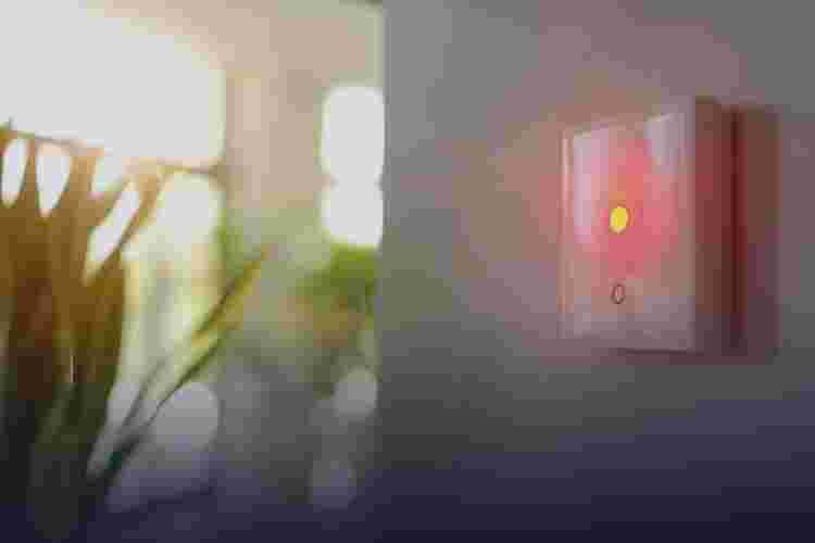 Internet of things , iot , smart home , kitchen , network connect concept. Human hand holding white phone, smart home application to count power usage